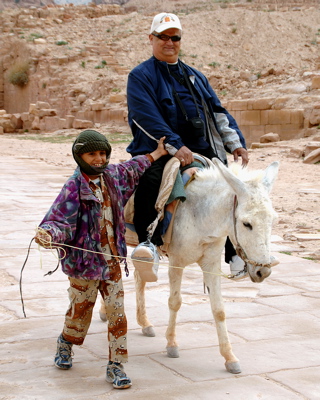David rides a donkey in Petra